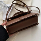 Compact leather sling bag for daily essentials