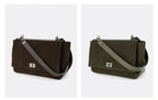 Textured suede handbag with flap closure