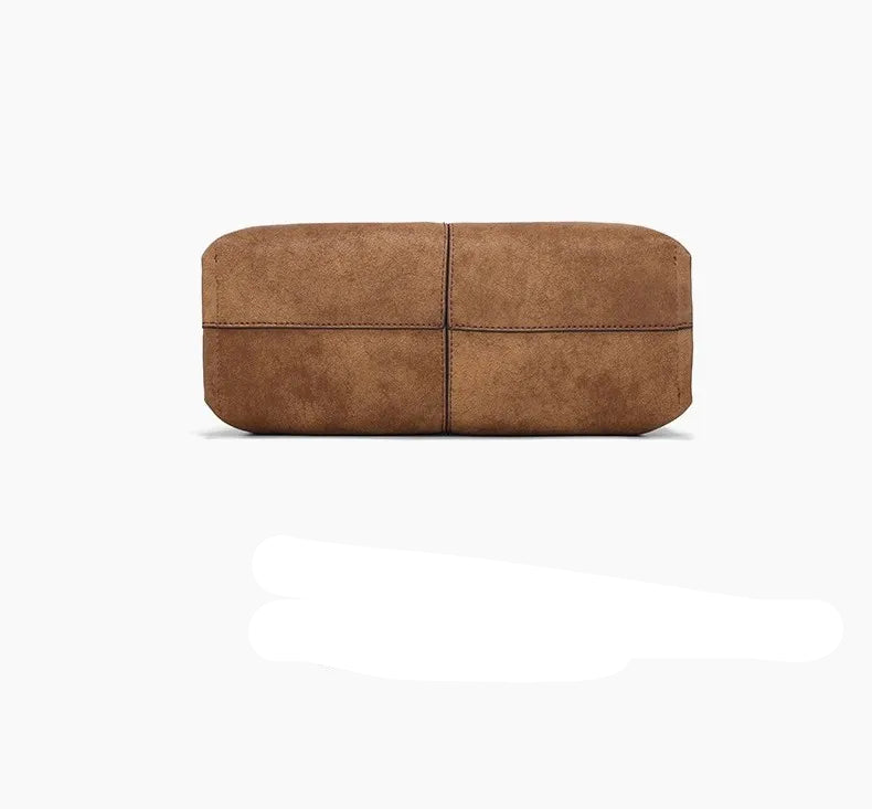 Suede handbag with rounded handles and zip closure