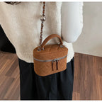 Classic suede handbag with structured handle