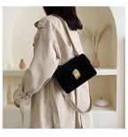 Corduroy handbag with chain and flap closure