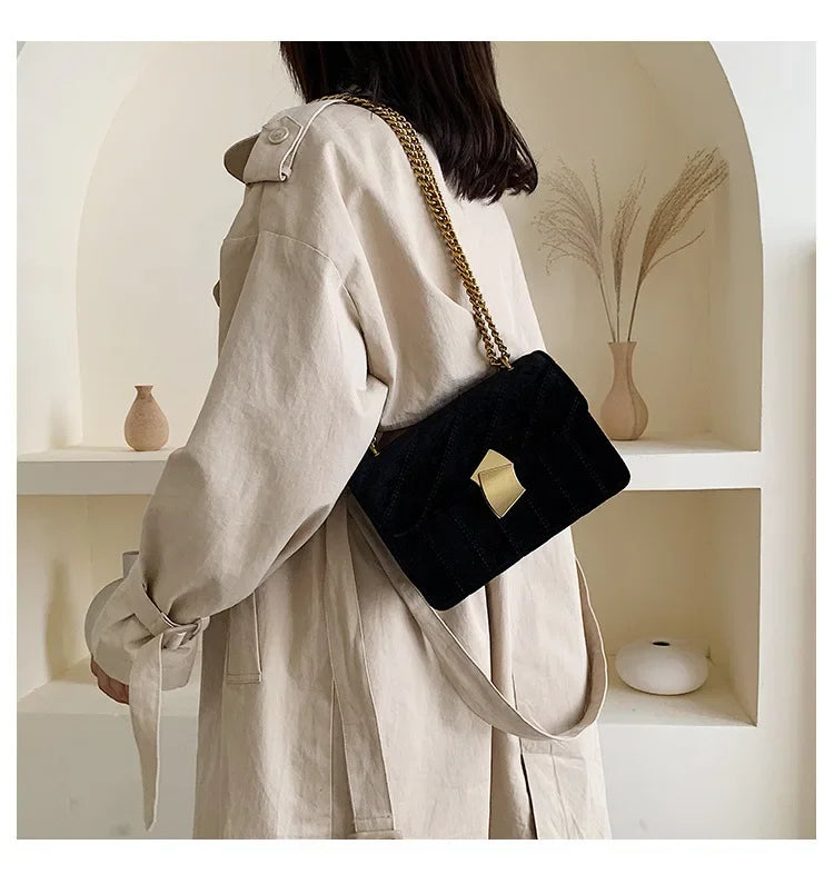 Corduroy handbag with chain and flap closure
