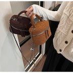 Classic suede handbag with structured handle