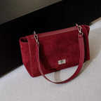 Textured suede handbag with flap closure