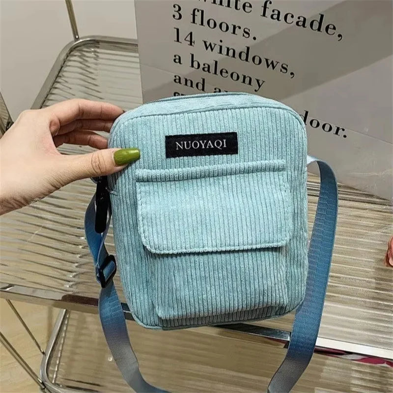 Corduroy crossbody handbag with front pocket