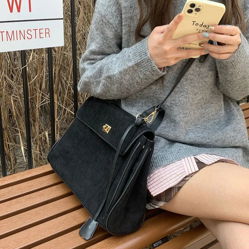 Structured modern suede handbag