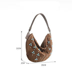 Soft suede handbag with elegant curved silhouette