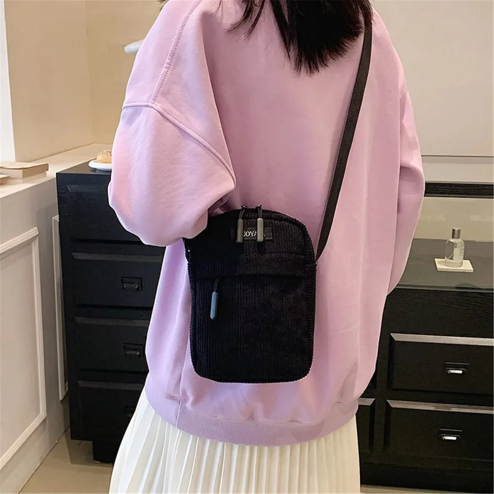 Compact corduroy crossbody bag