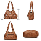 Leather shoulder bag with side pockets
