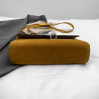 Structured suede handbag with minimalist shape