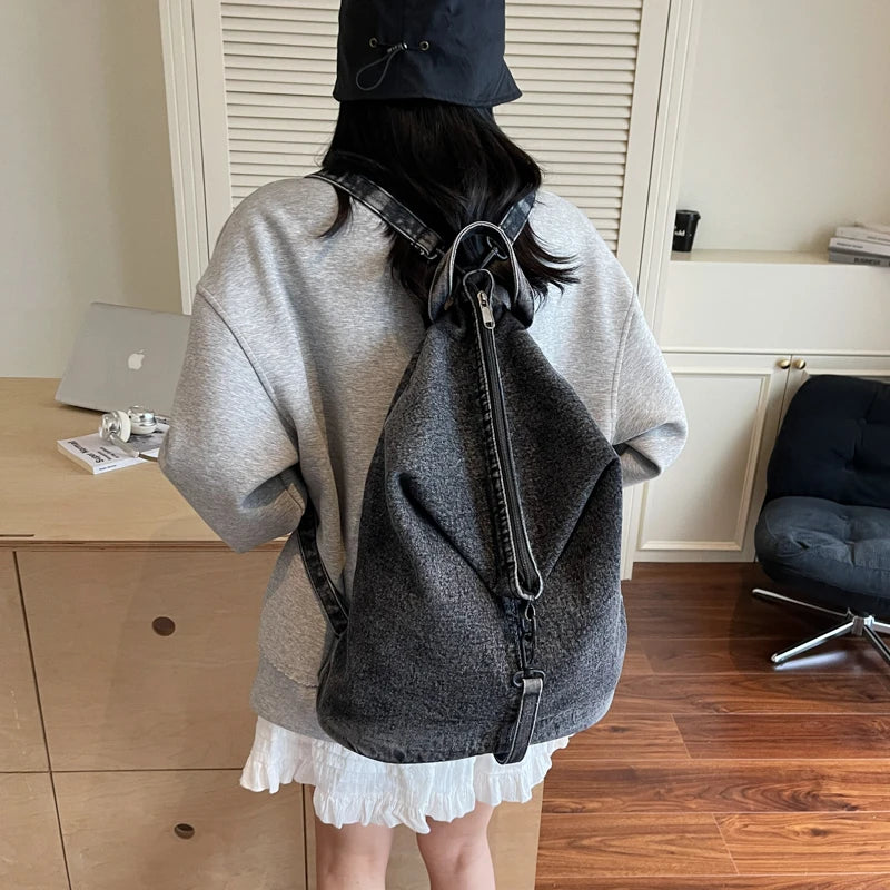 Washed denim backpack with adjustable straps