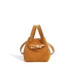 Designer-inspired suede handbag