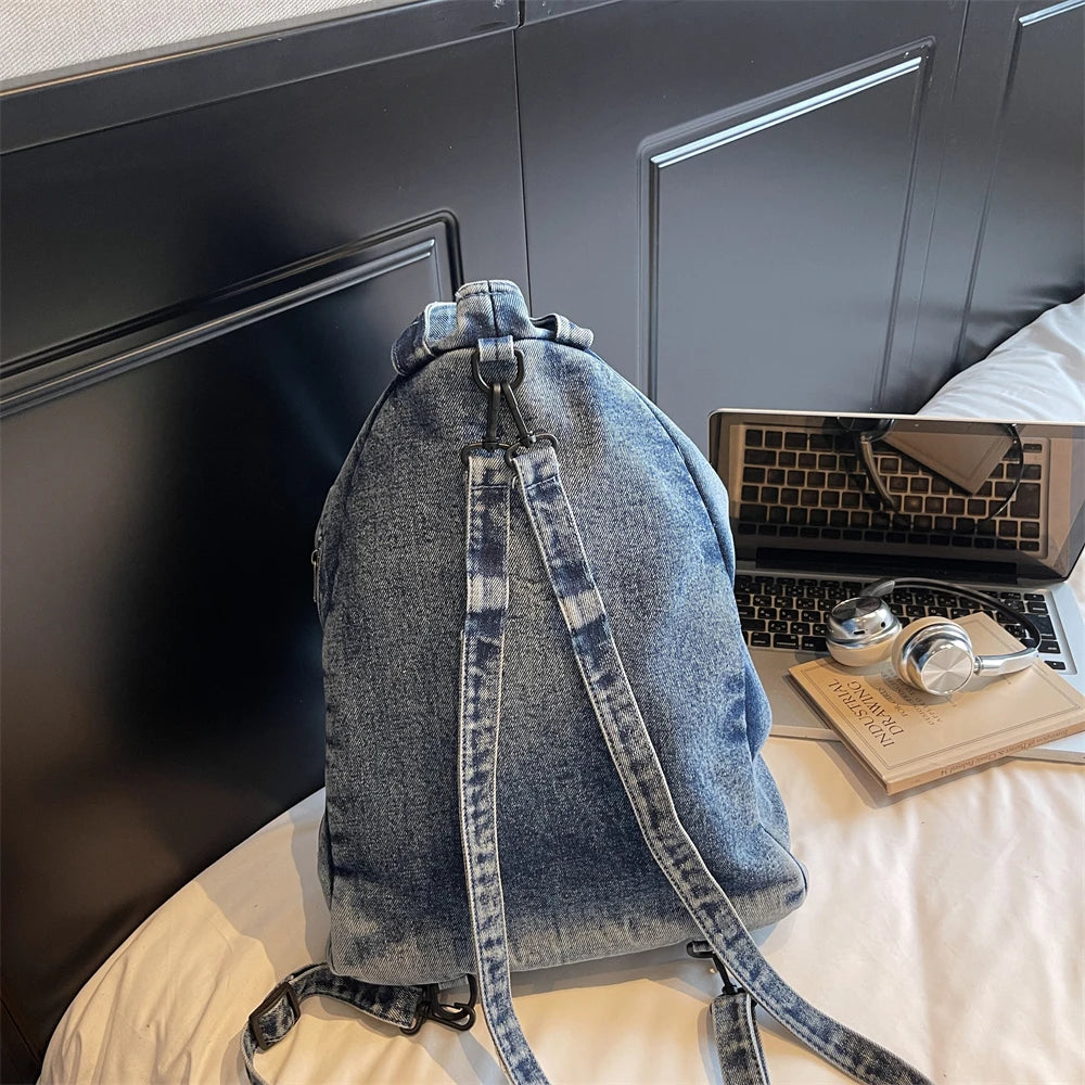 Washed denim backpack with adjustable straps