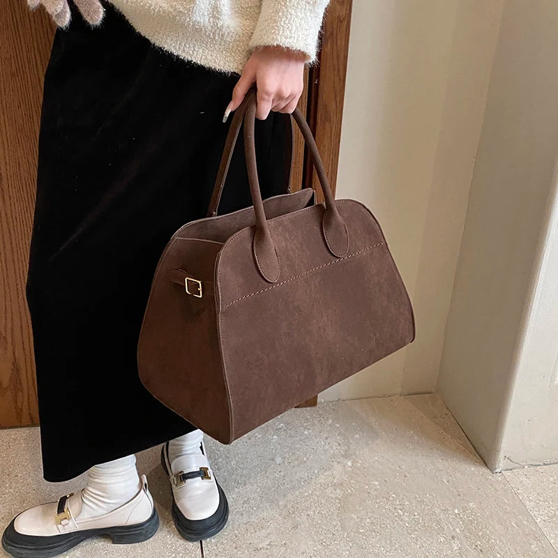 Suede handbag with shoulder strap