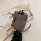 Compact corduroy crossbody bag