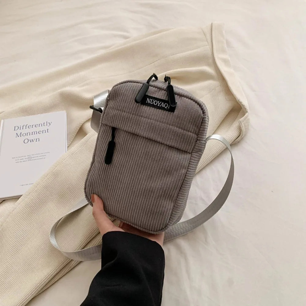 Compact corduroy crossbody bag
