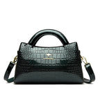 Soft leather handbag with curved top edge
