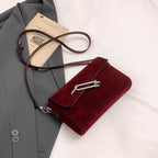 Structured suede handbag with minimalist shape