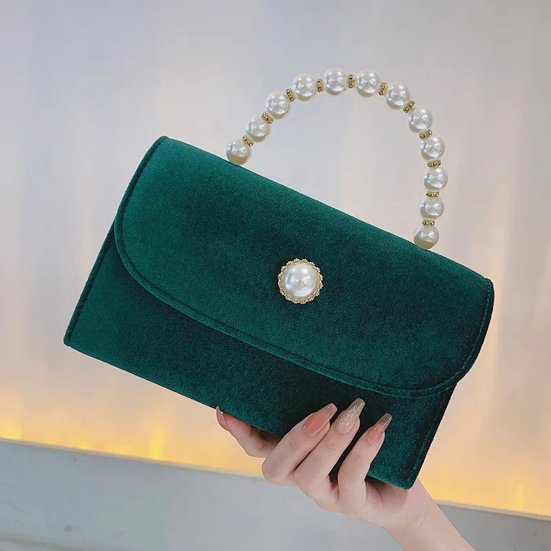 Corduroy clutch bag with envelope flap design