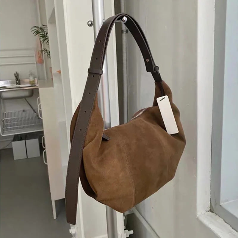 Soft suede slouch bag with single shoulder carry