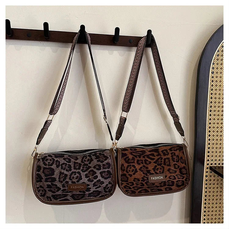 Sleek suede purse with wide shoulder strap