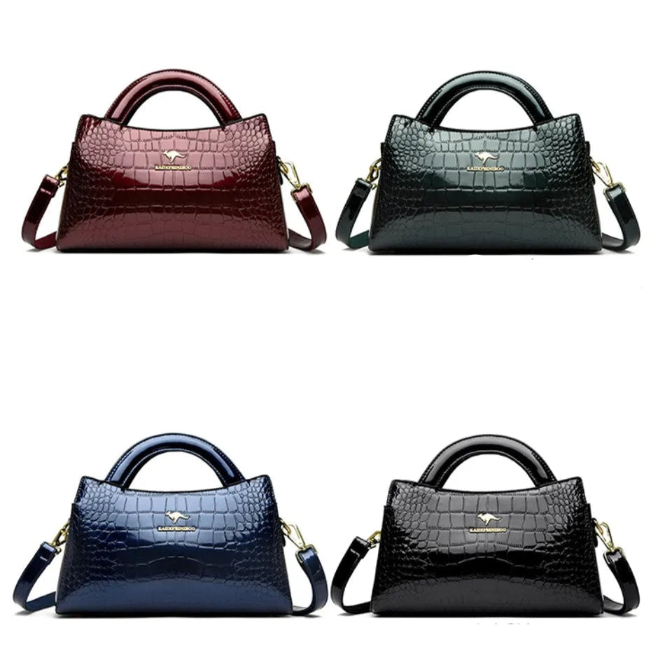 Soft leather handbag with curved top edge