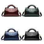 Soft leather handbag with curved top edge
