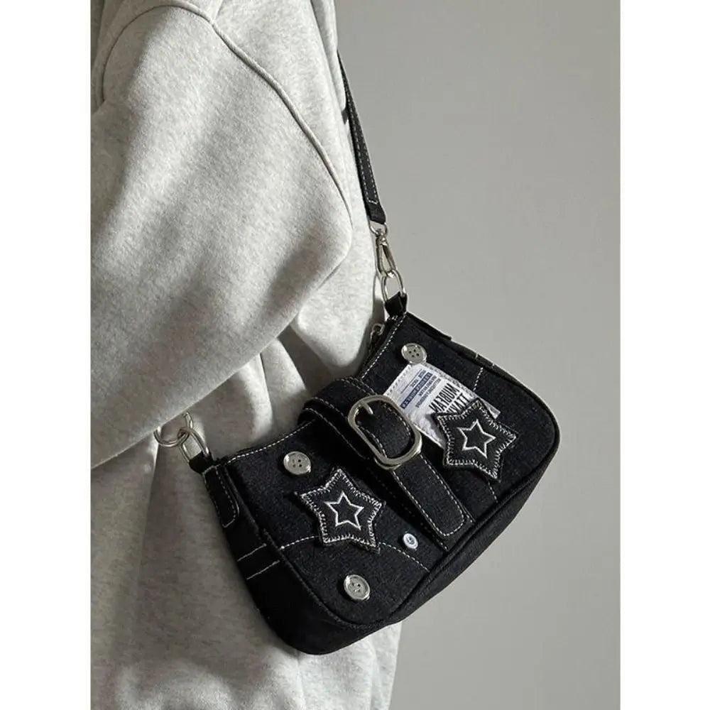 Edgy black denim handbag with buckle strap