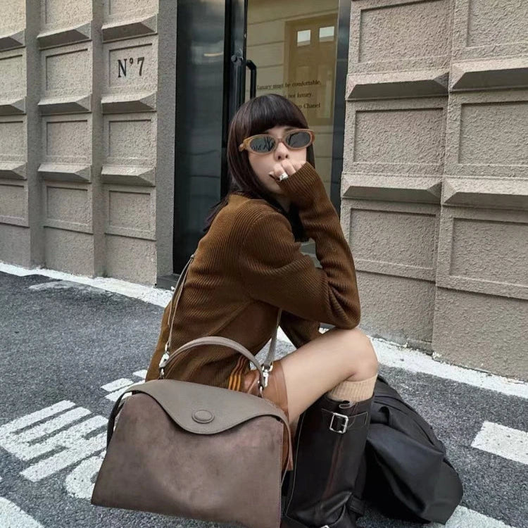 Suede handbag with subtle colors