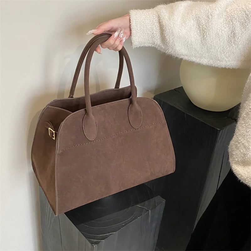 Suede handbag with shoulder strap