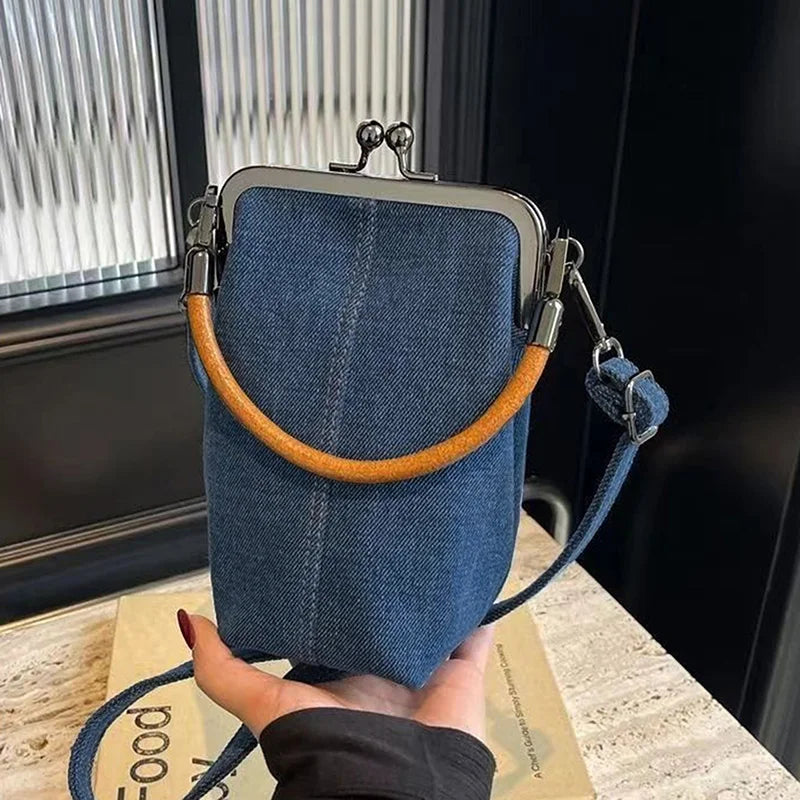 Distressed denim clutch bag with vintage vibes