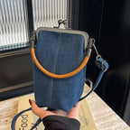 Distressed denim clutch bag with vintage vibes
