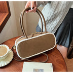 Elegant suede handbag with vintage charm