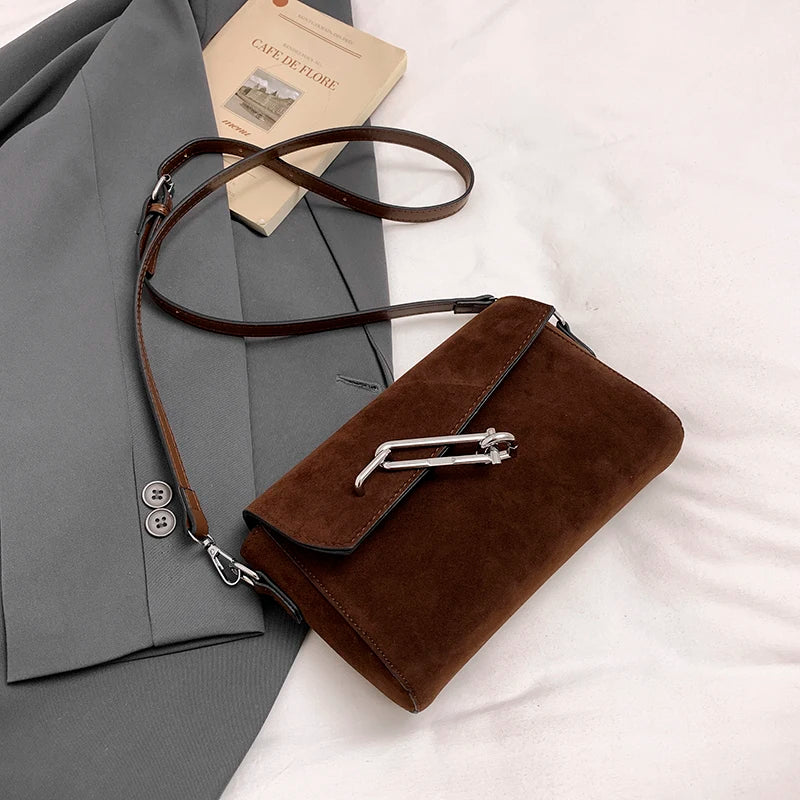 Structured suede handbag with minimalist shape