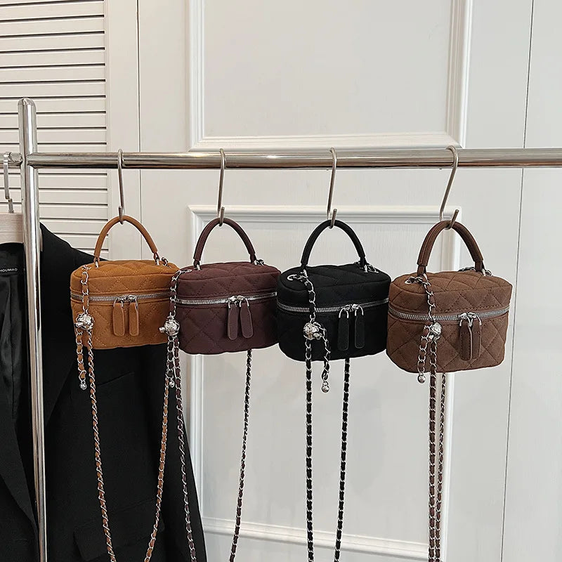 Classic suede handbag with structured handle
