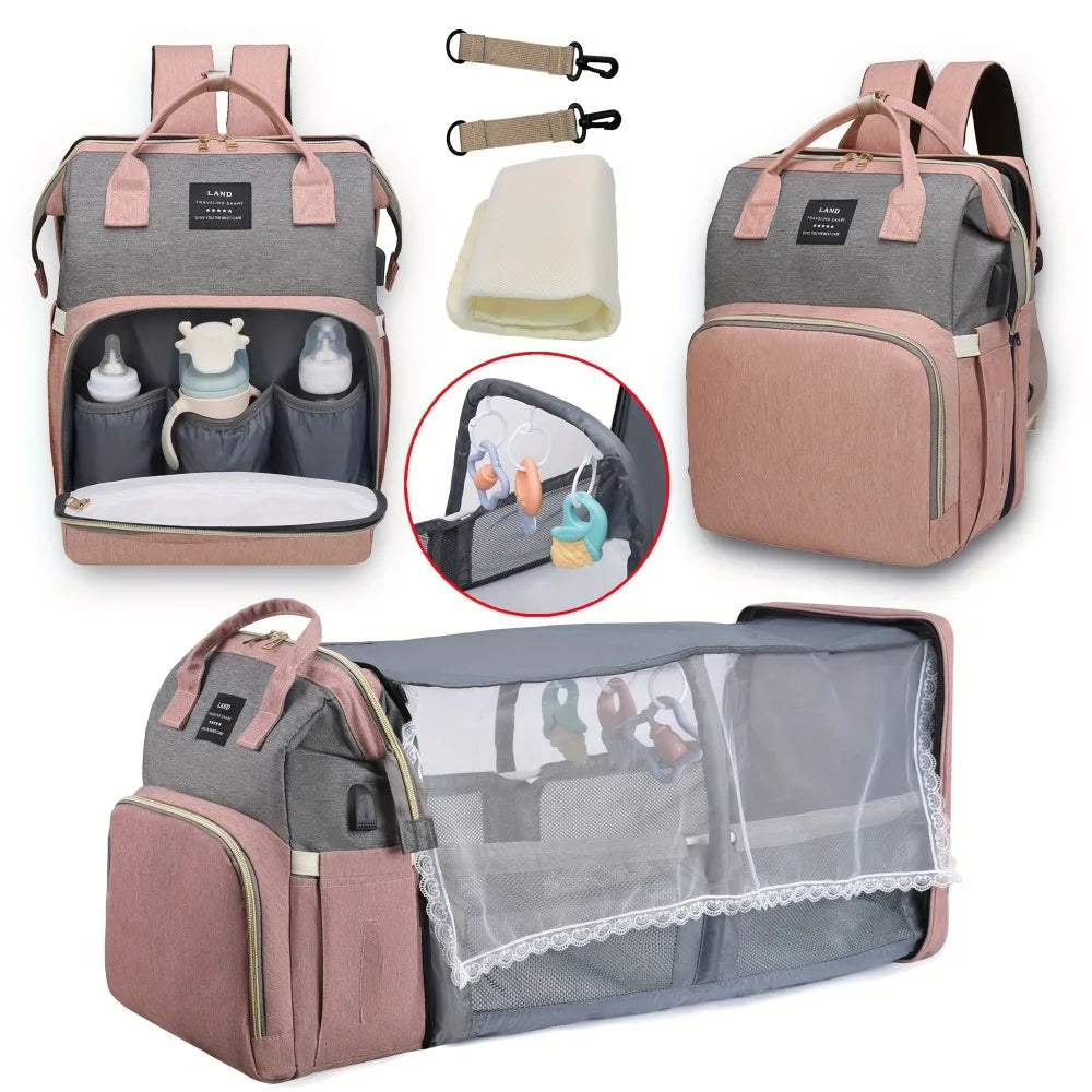 Pink diaper backpack with built-in bed