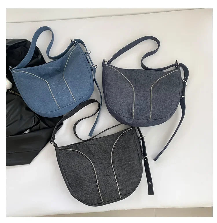Soft washed denim shoulder bag with casual fold design
