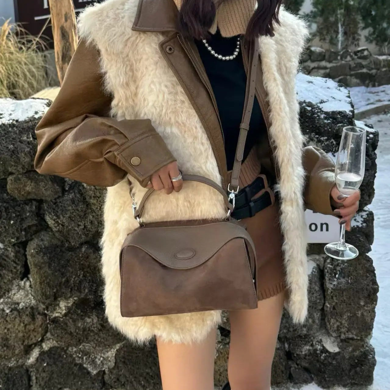 Suede handbag with subtle colors