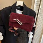 Structured suede handbag with minimalist shape