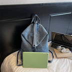 Washed denim backpack with adjustable straps