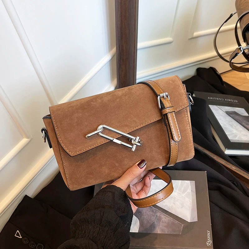 Structured suede handbag with minimalist shape