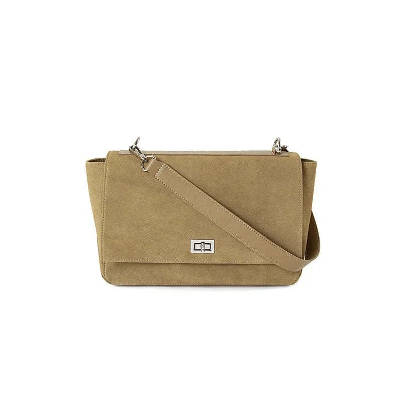 Textured suede handbag with flap closure