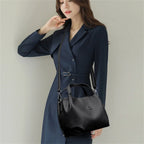 Leather handbag with wide base