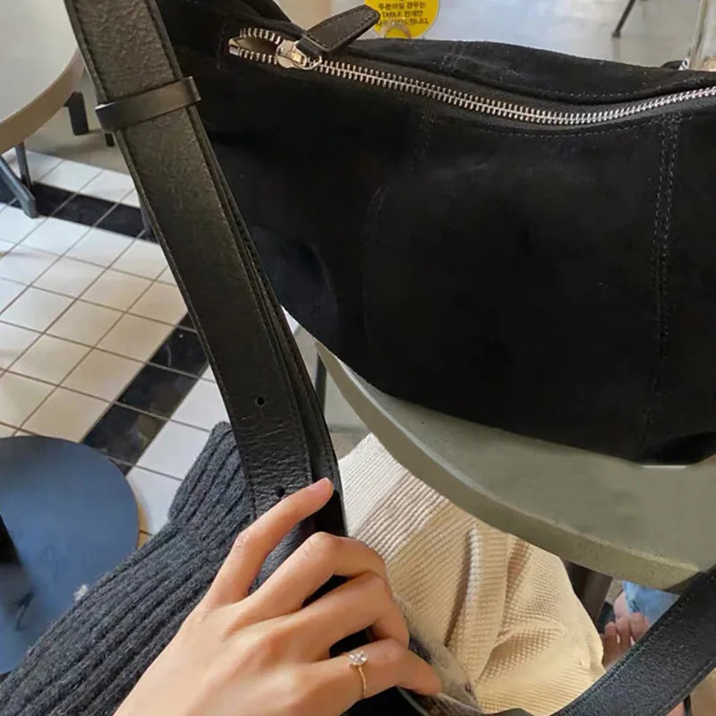 Soft suede slouch bag with single shoulder carry