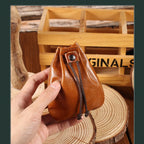 Compact drawstring pouch in leather
