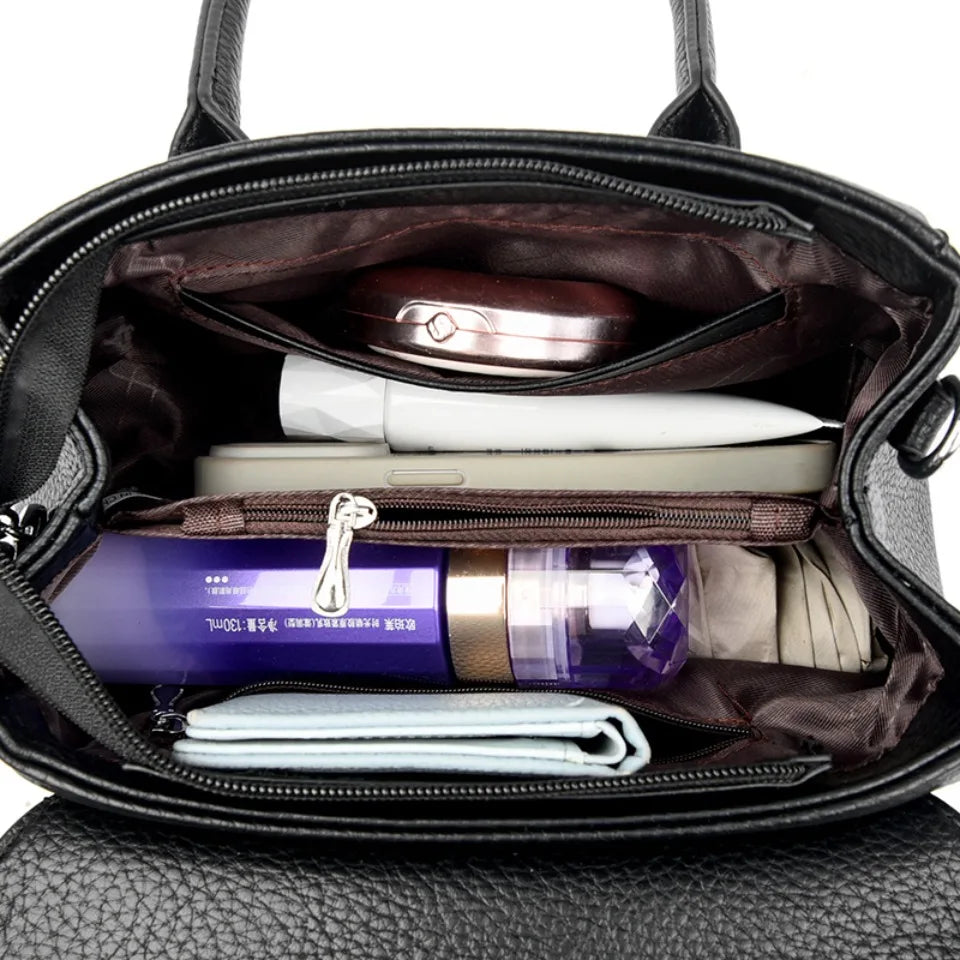 Designer-inspired leather handbag