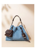 Denim handbag with external pockets