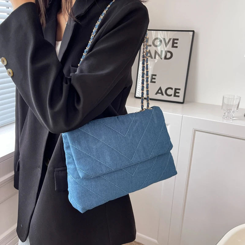 Flap-style denim shoulder handbag