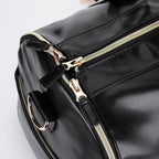 Elegant leather holdall with shoulder strap