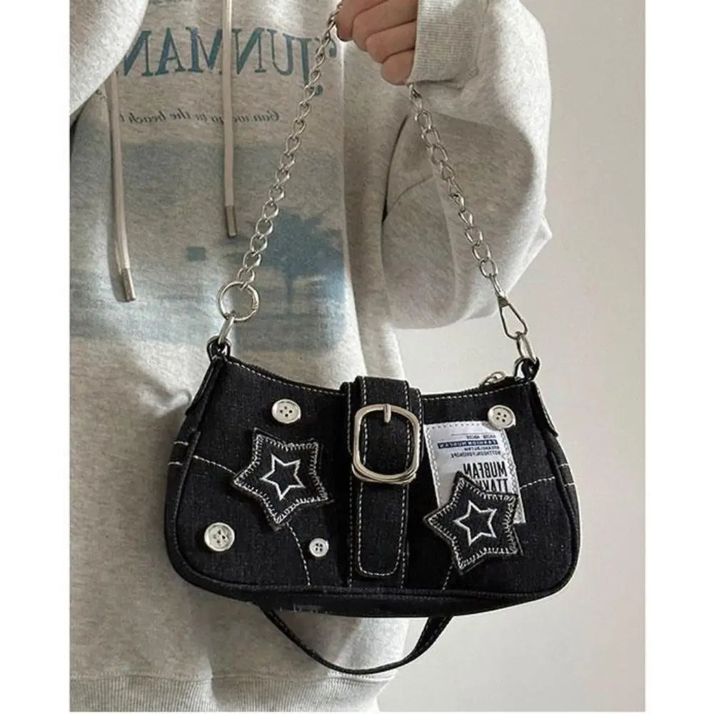 Edgy black denim handbag with buckle strap